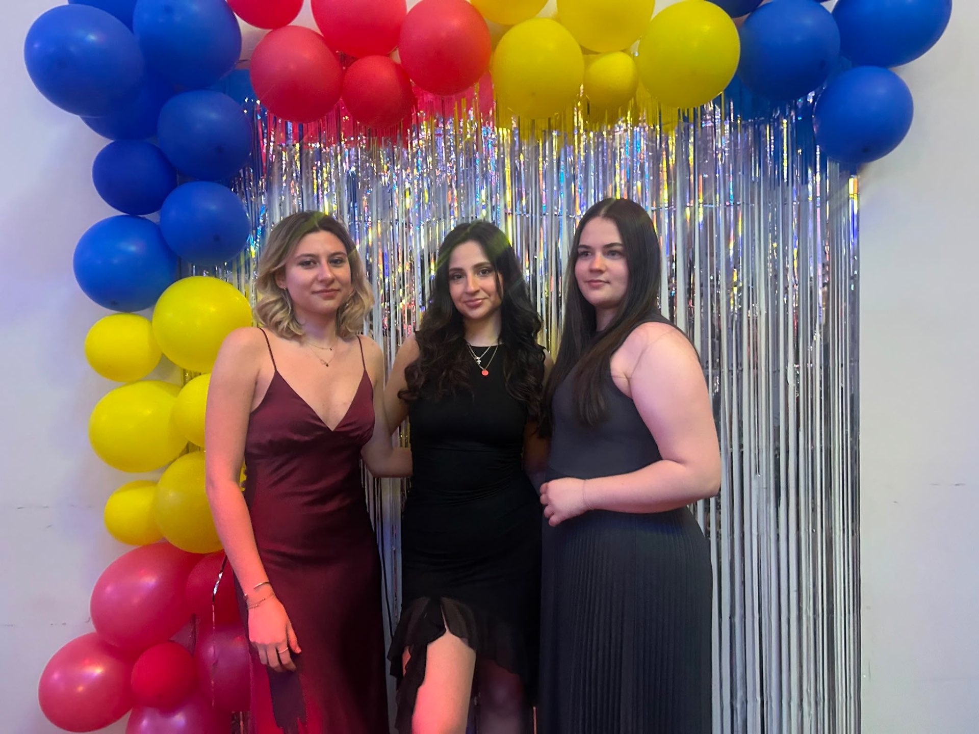 Romanian Bal 2026 — Friends at the Balloon Arch